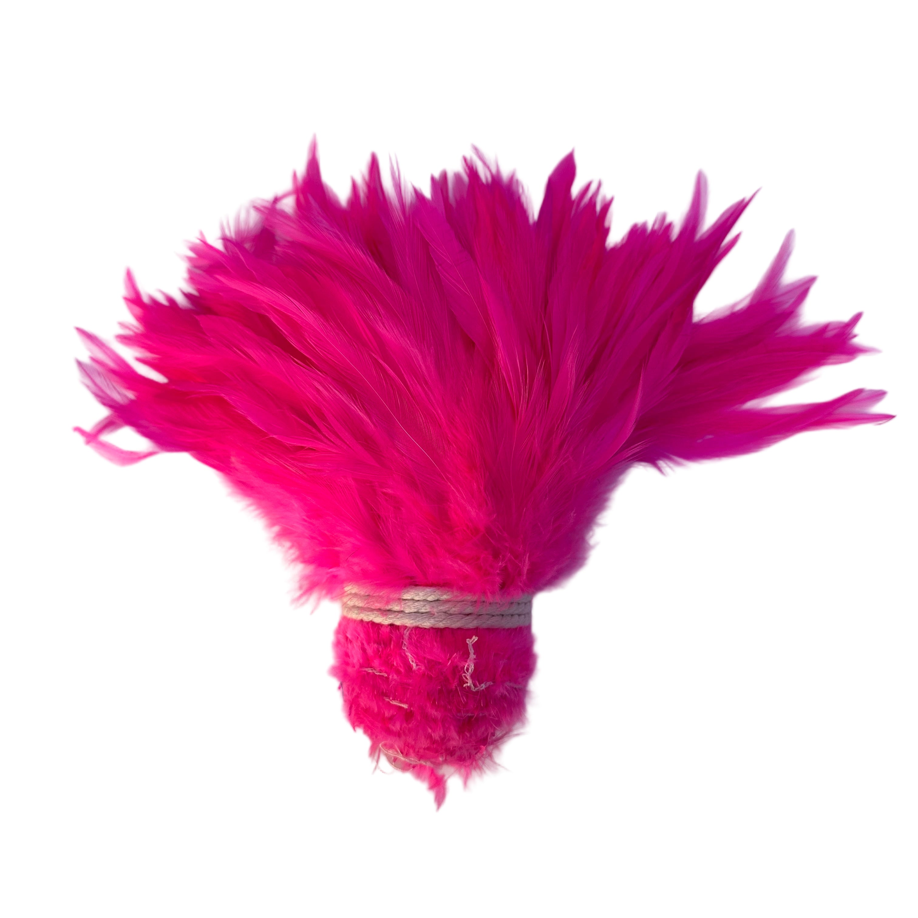 Bunch of bright pink feathers tied together on a light purple background